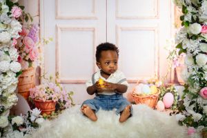 Denim and casual wear portraits in a romantic floral studio setting with soft lighting.