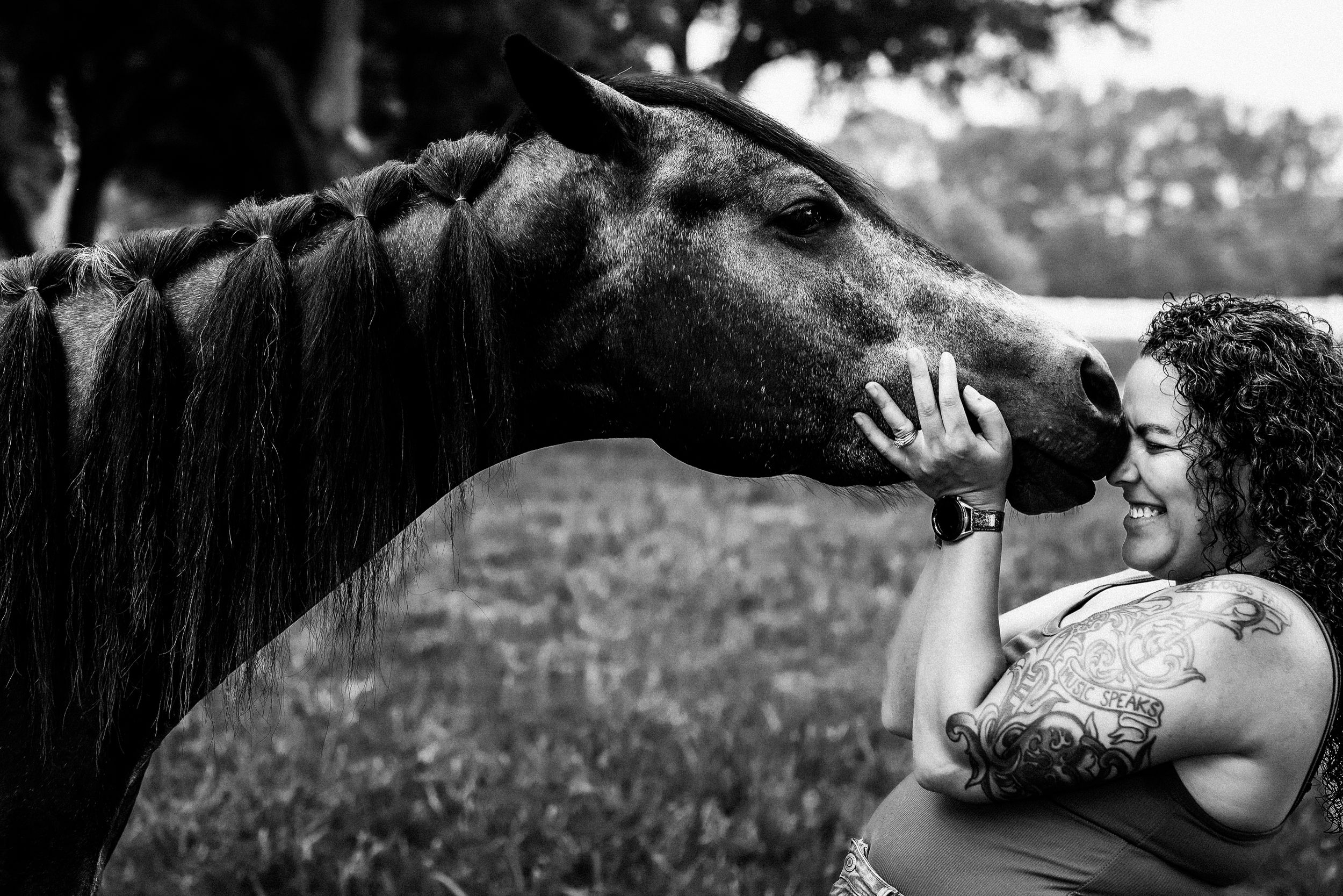 Woman being silly with her horse in open field, natural setting, candid equine portrait at golden hour, taken by Tasha Cannaday in Windsor