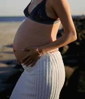 Dreamy and cinematic maternity session by the ocean, golden light, and timeless beauty, capturing the magic of motherhood maternity NYC