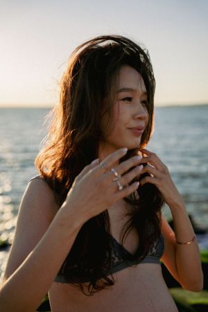 Dreamy and cinematic maternity session by the ocean, golden light, and timeless beauty, capturing the magic of motherhood maternity NYC