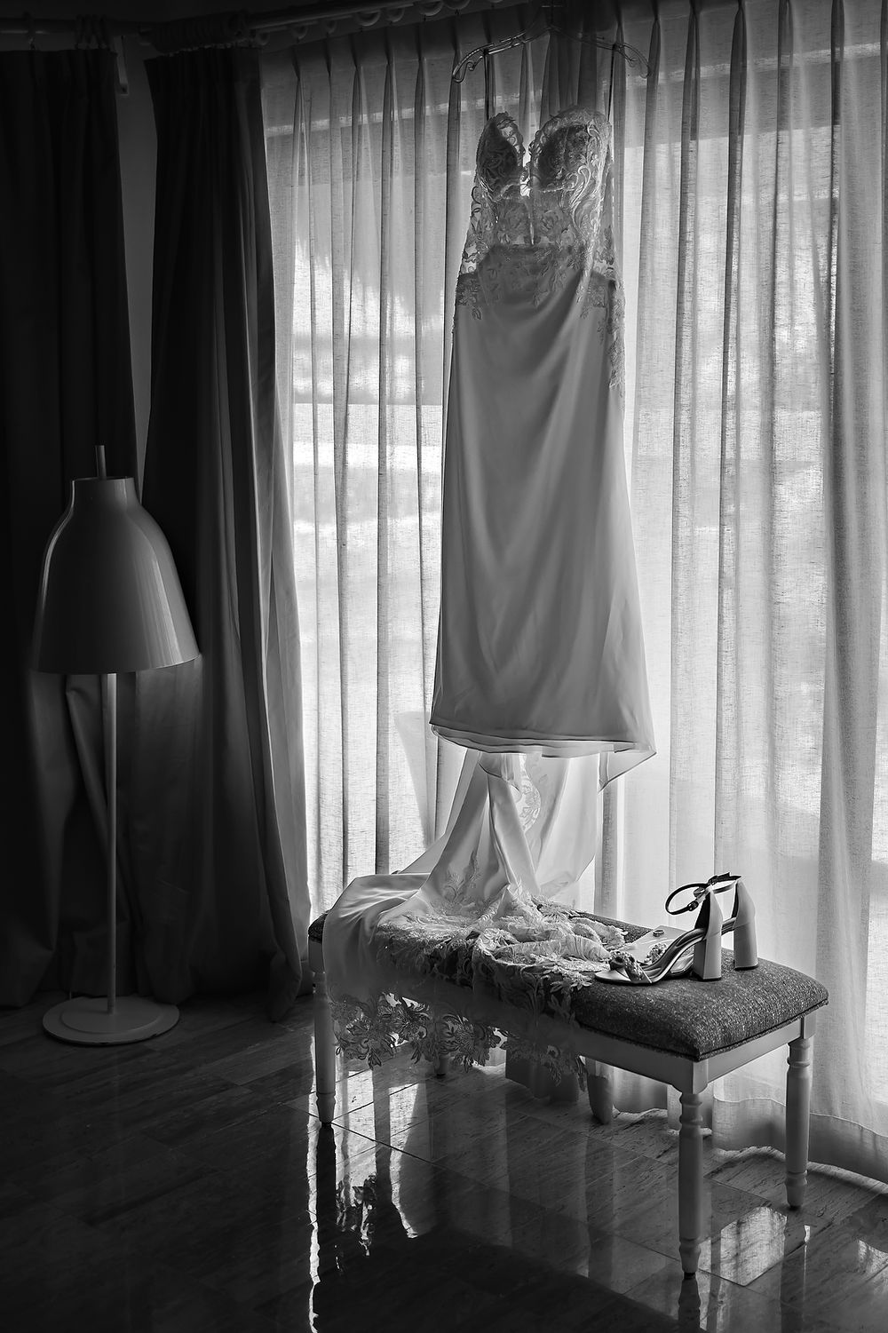 Bride’s dress hanging near window, wedding at Grand Palladium Kantenah.