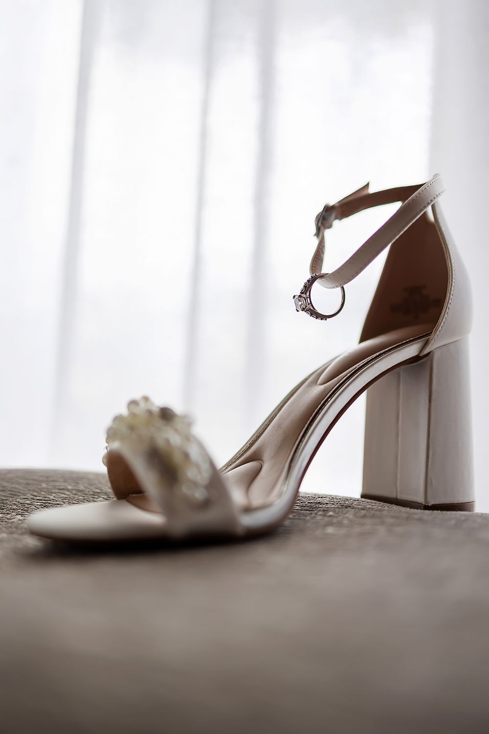 Bridal shoes by the window, detail shot at Grand Palladium Kantenah.