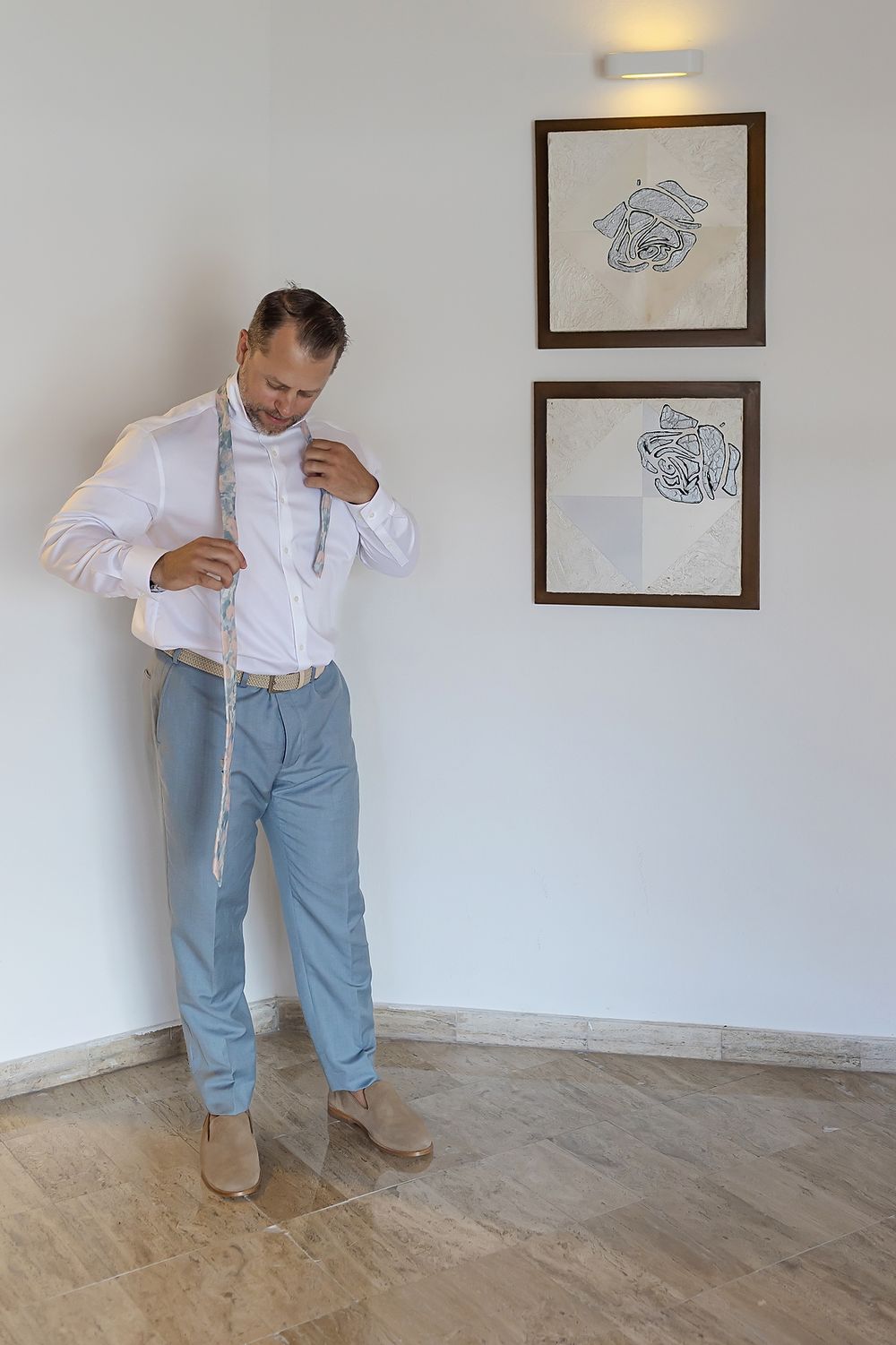 Groom getting dressed for beach ceremony, Grand Palladium Kantenah.