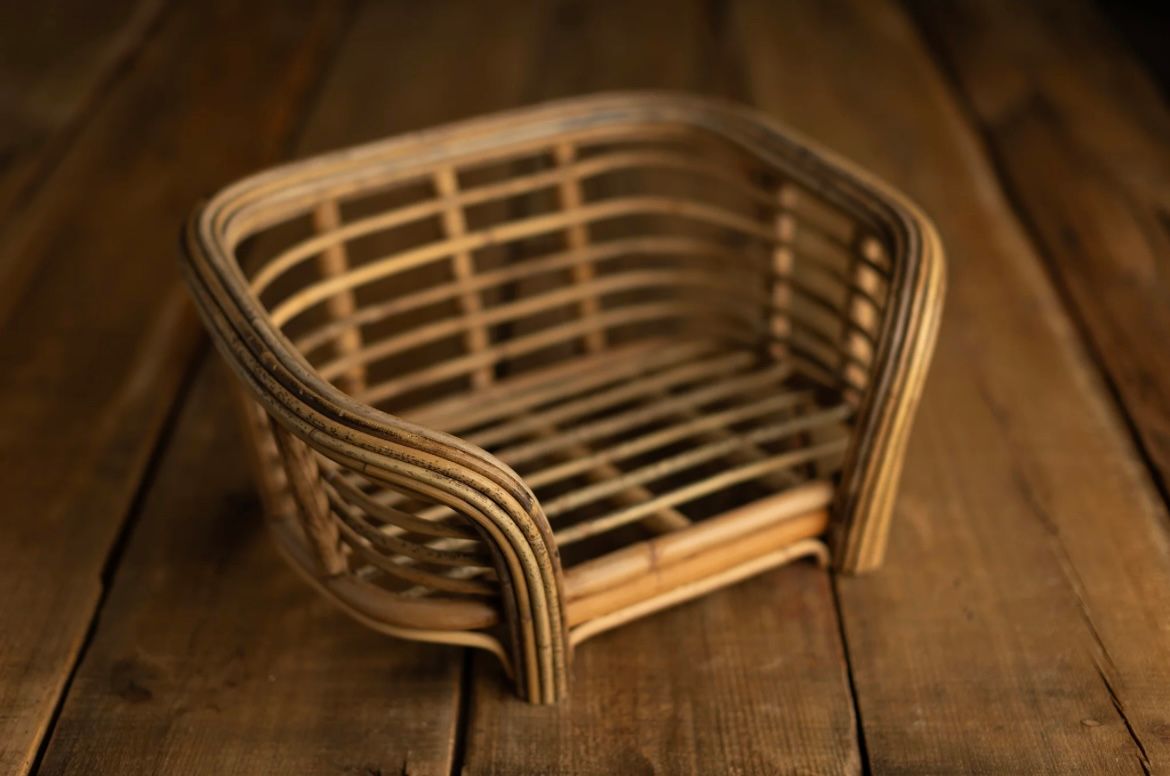 Handcrafted wooden chair components showing curved bentwood pieces arranged on a rustic workbench surface.