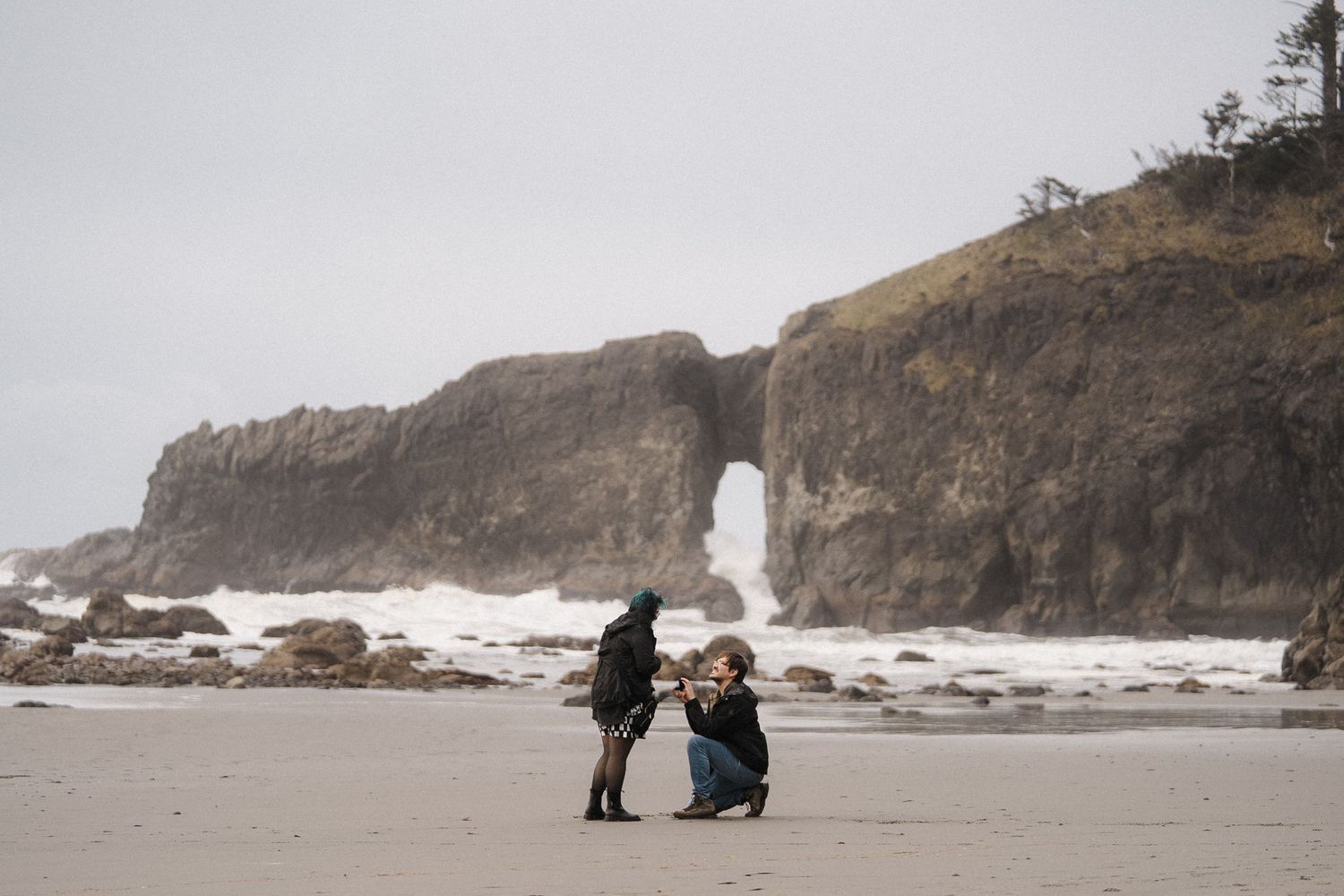 A series of misty ocean landscapes shows waves crashing against rocky coastal cliffs on a moody, overcast day.