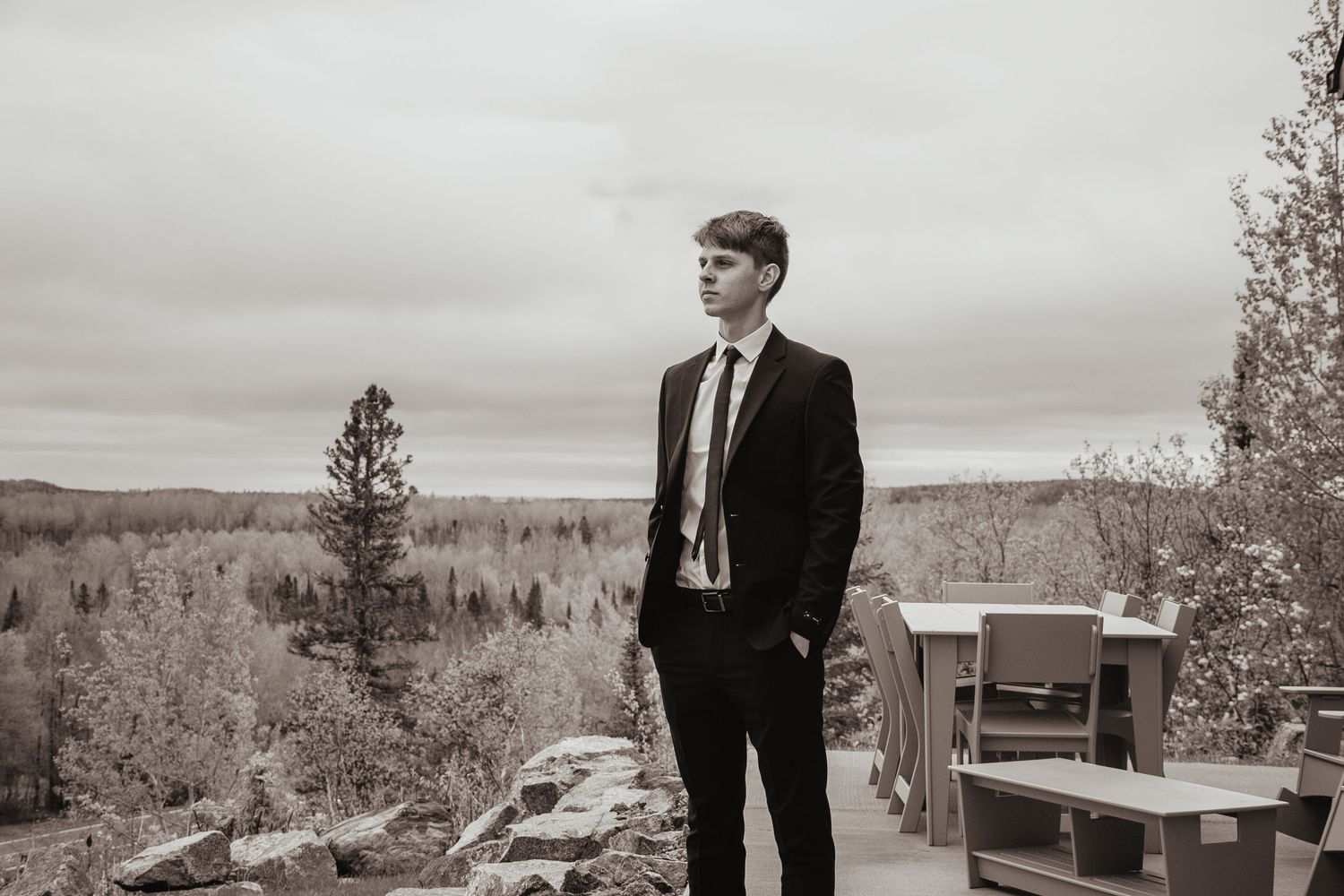 Professional black and white wedding photography displayed in a multi-image panel showing outdoor scenic views.