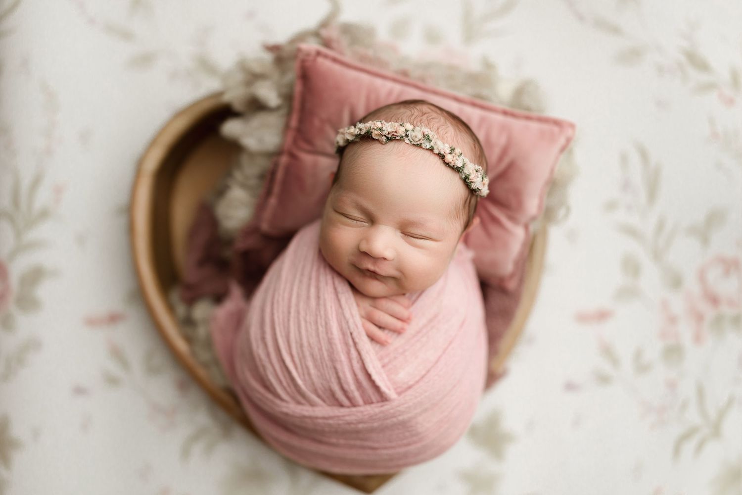 wrapped up baby girl newborn posing