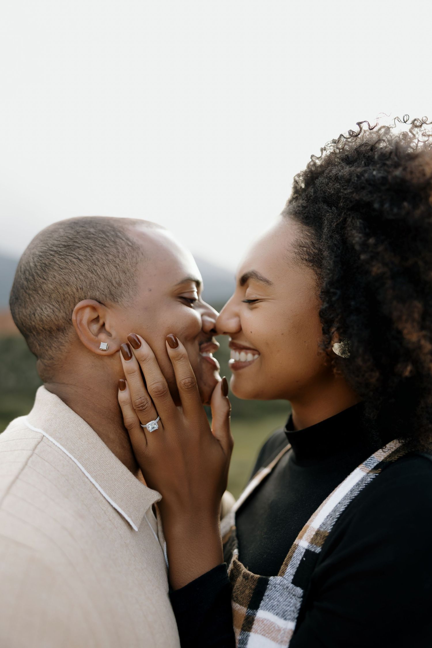 A romantic couple shares intimate moments in a series of close-up profile shots outdoors.