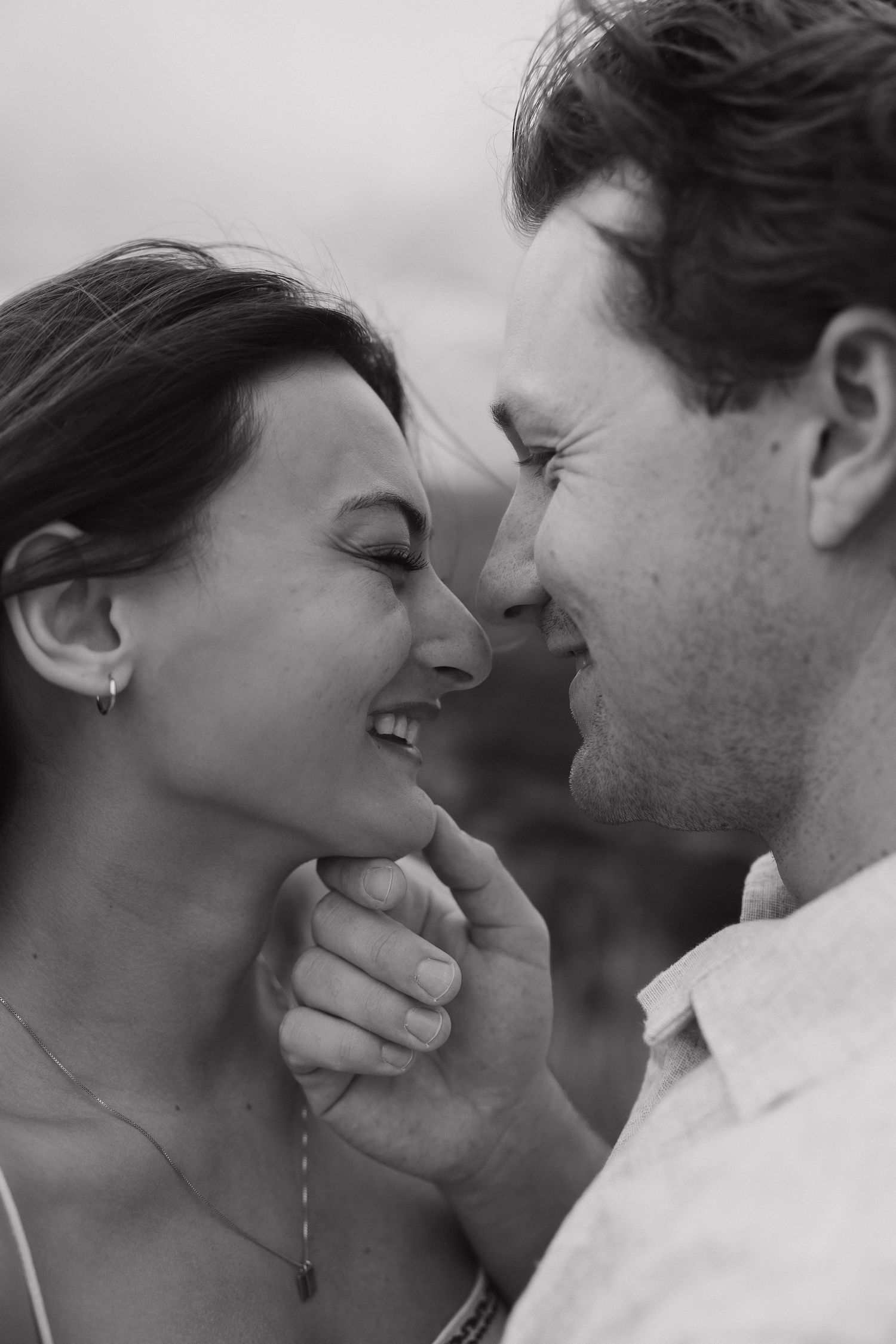 Close-up black and white photo series captures intimate loving moments between couple.