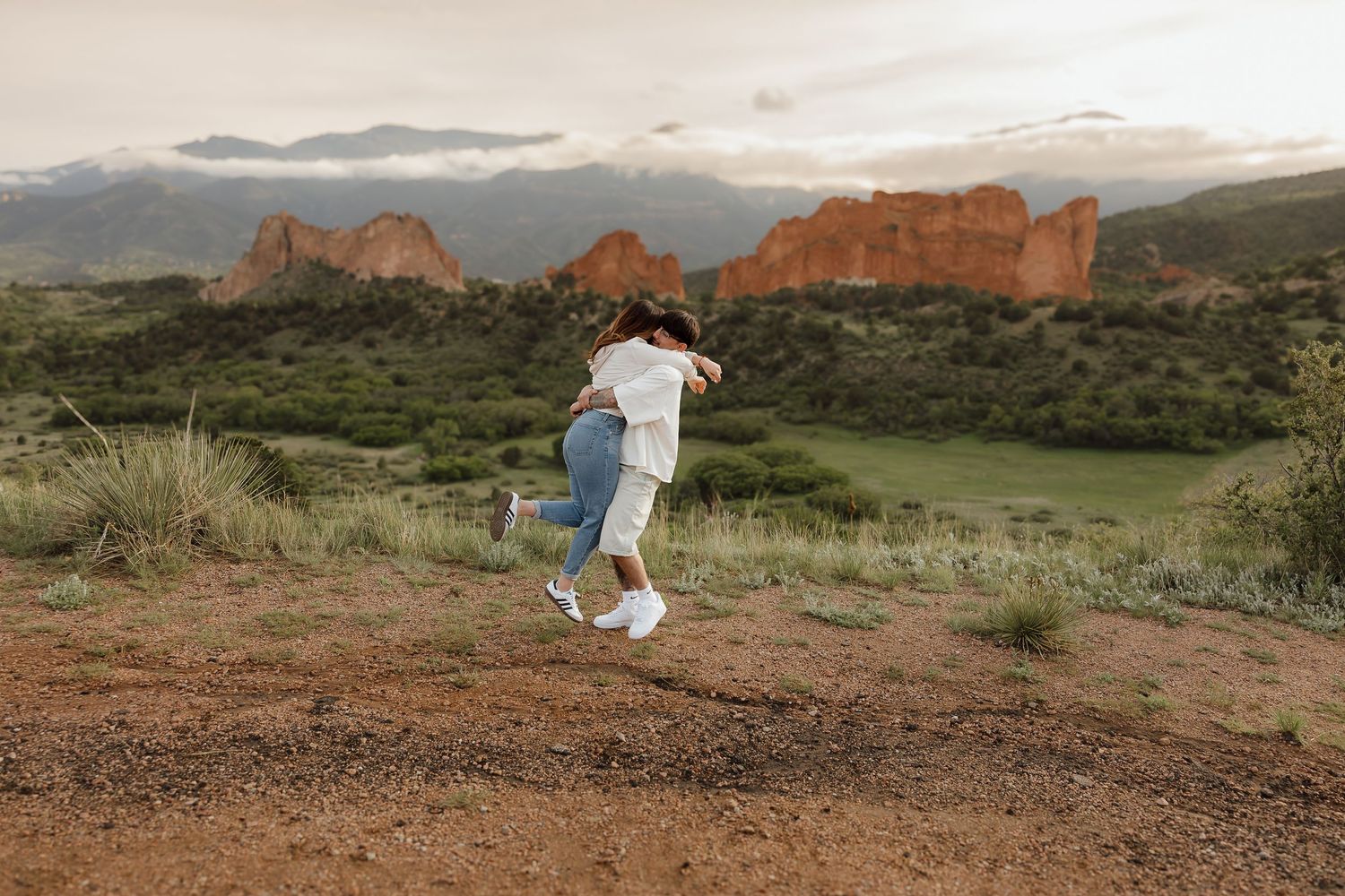 A person takes selfies while hiking through the red rock formations at Garden of the Gods in Colorado Springs.