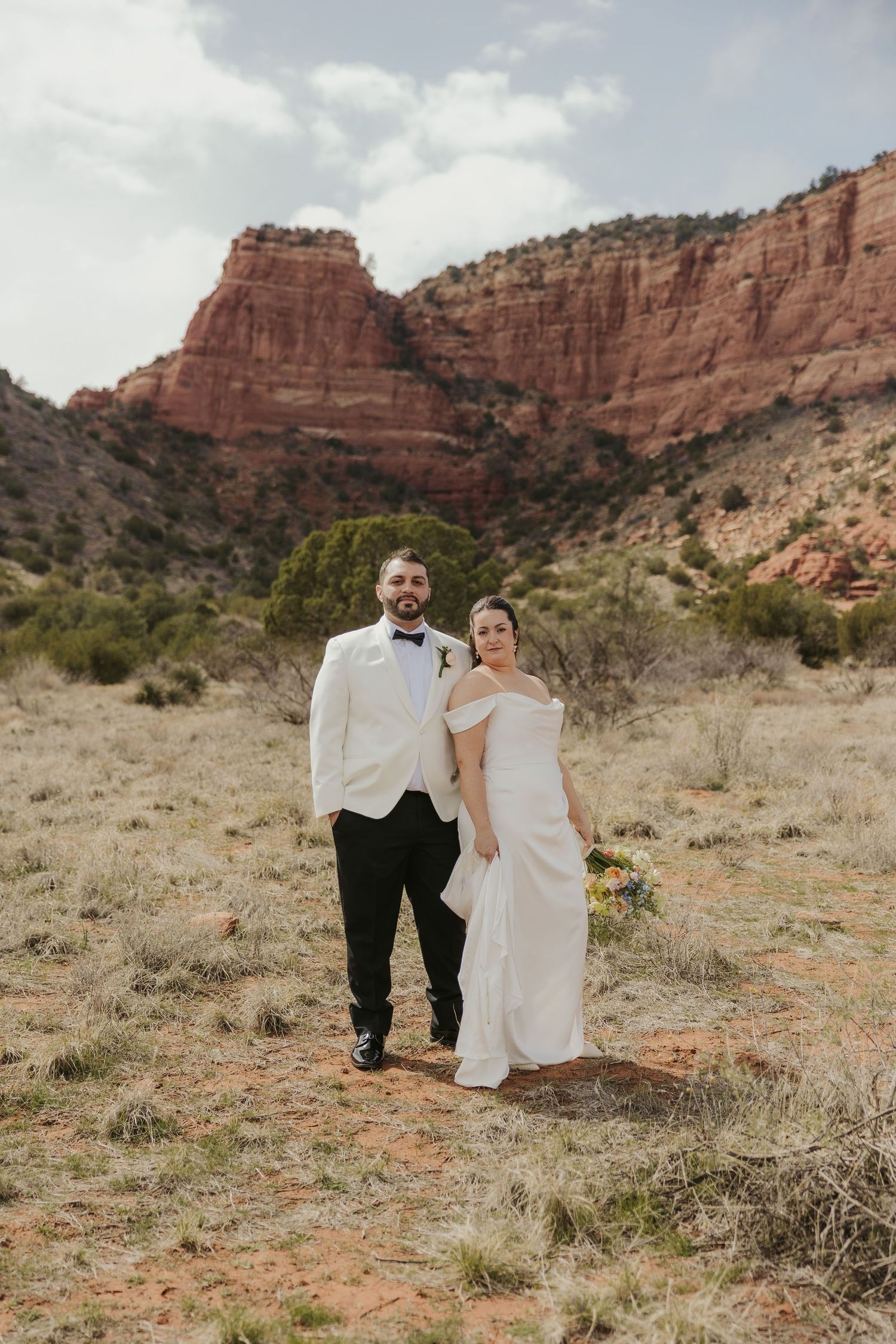 Sedona desert wedding photos with red rock formations in the background.