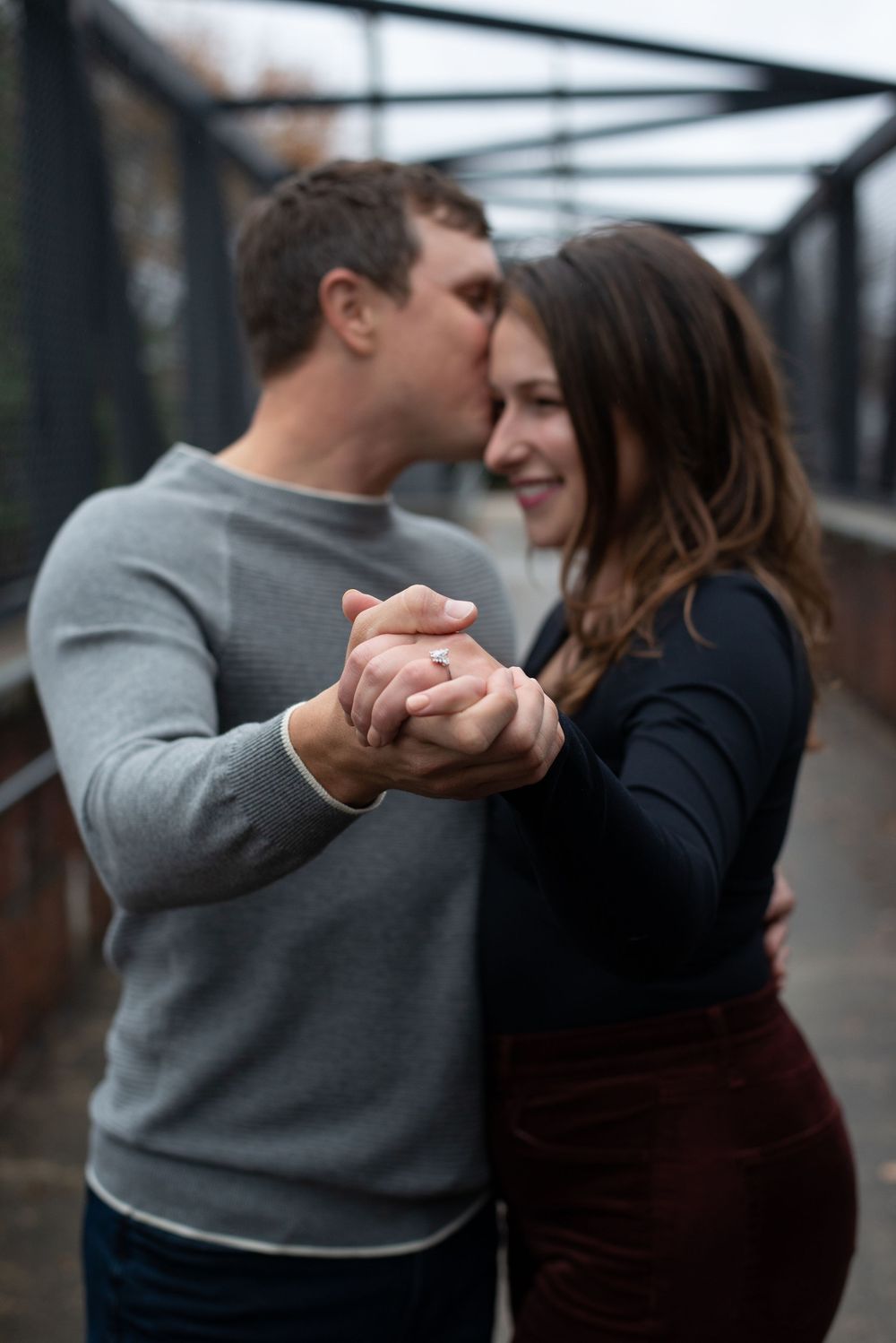 A romantic couple dances together in an intimate sequence of photos showing them embracing and holding hands.