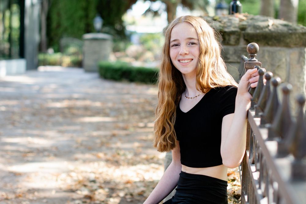 A series of outdoor autumn photos showing someone playing with bubbles and enjoying activities in a park setting.