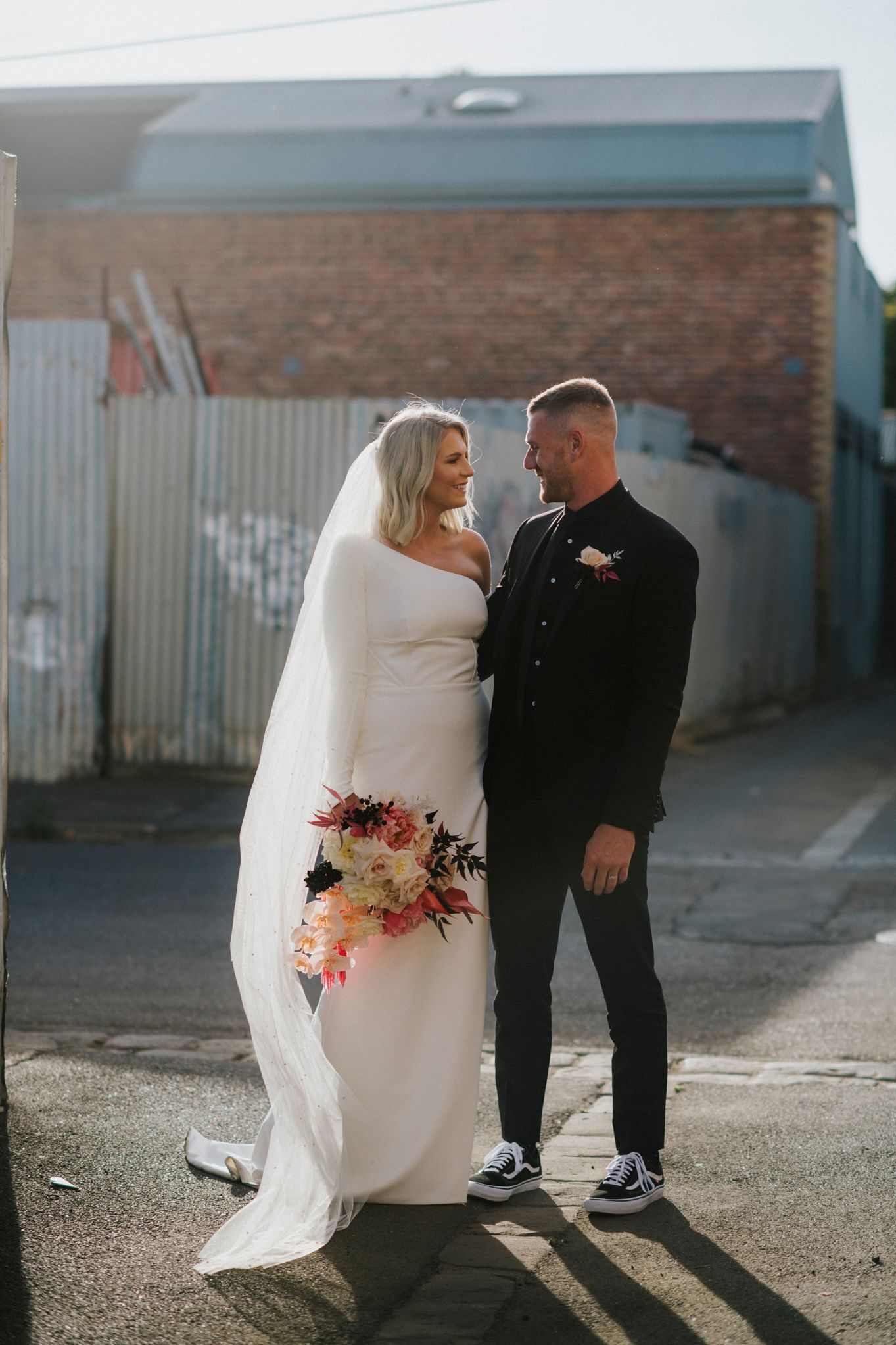 A tender wedding photo sequence showing a couple in formal attire sharing intimate moments against an urban backdrop.