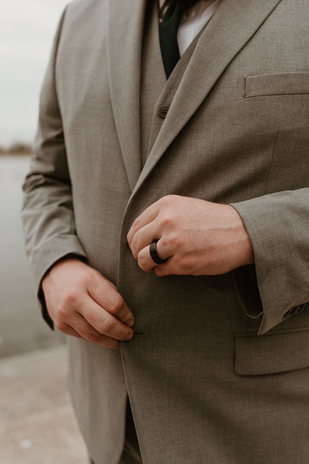 Close-up details of a taupe suit jacket showing texture and buttons in multiple angles.