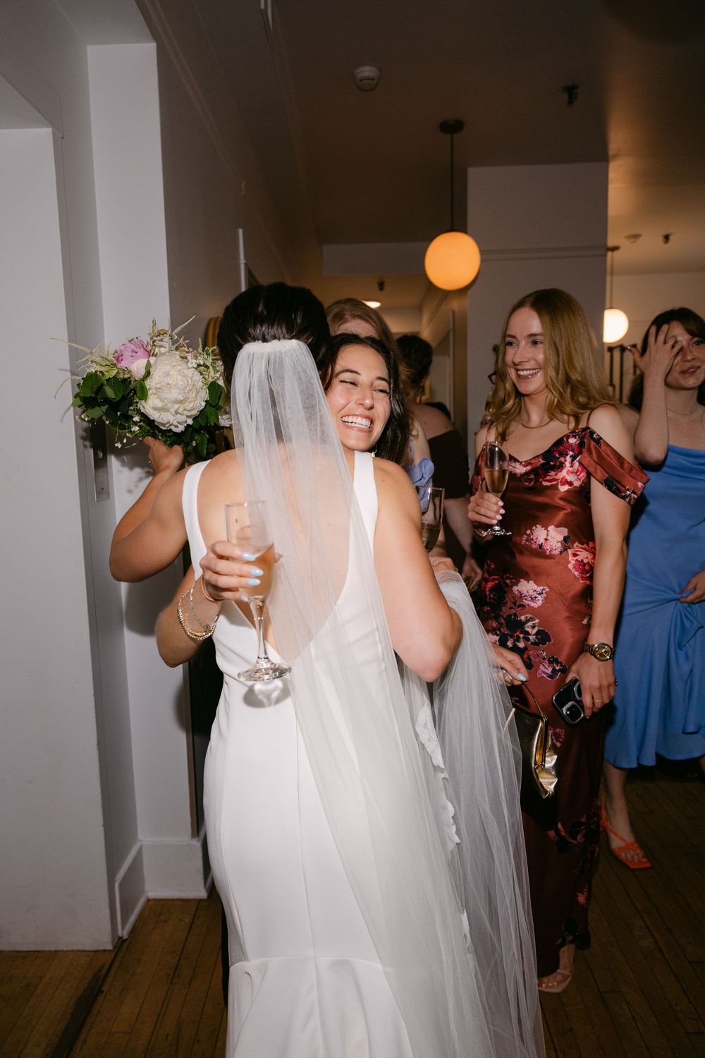 A sequence of candid photos showing wedding guests dancing and celebrating at a reception party with warm lighting.