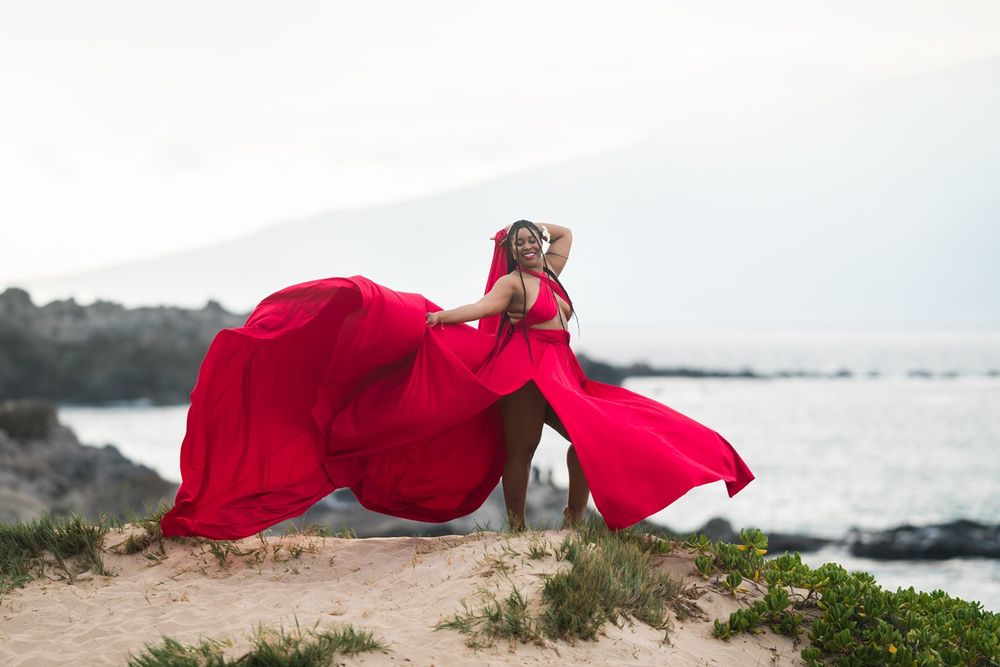 Maui flying dress photographer photo against beautiful Maui sunset beach by ohwowfotos.