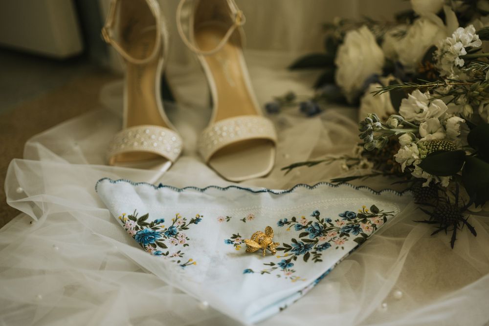 Wedding rings placed on invitation suite with lace texture from Lafayette wedding