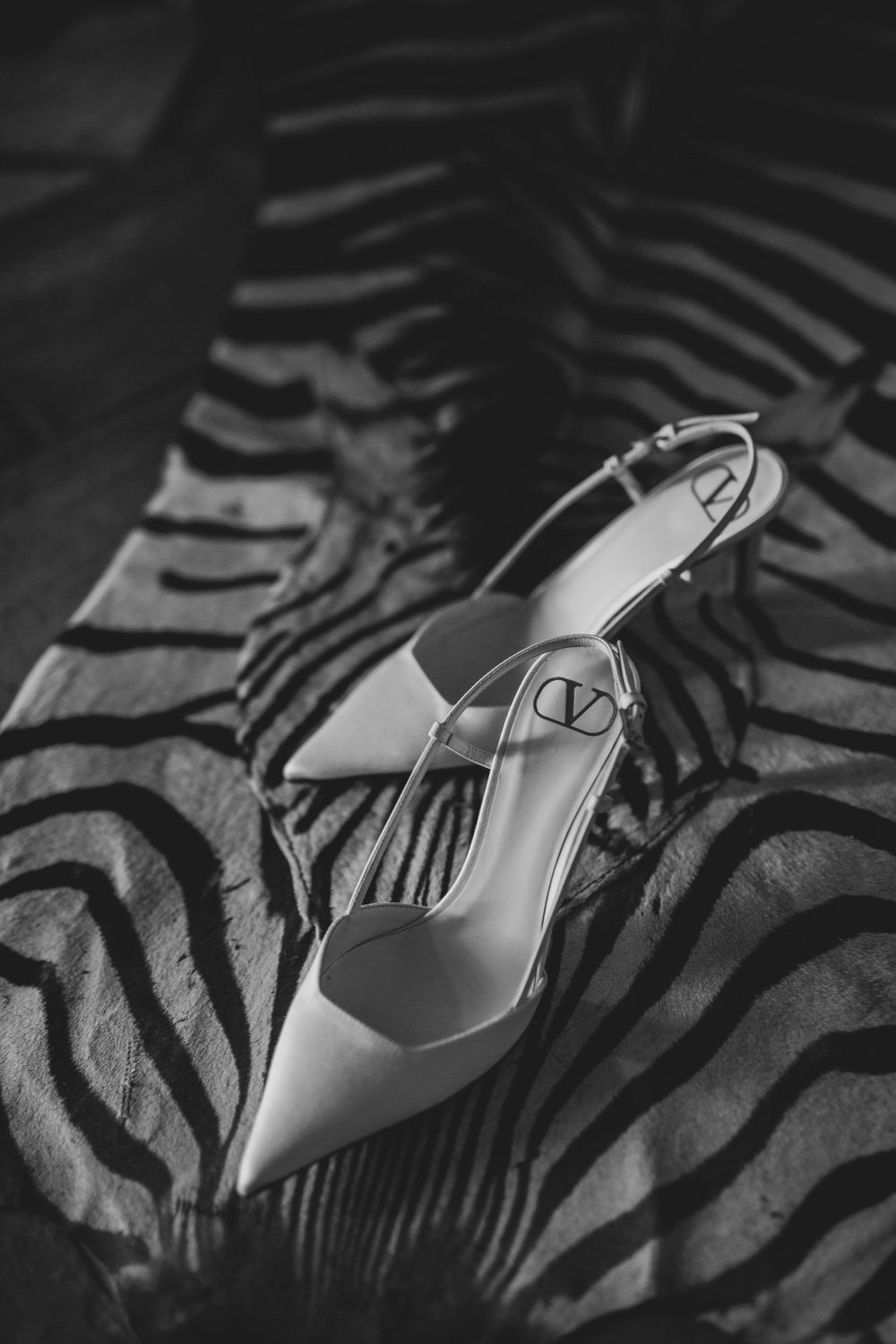 bride shoes black and white editorial photography