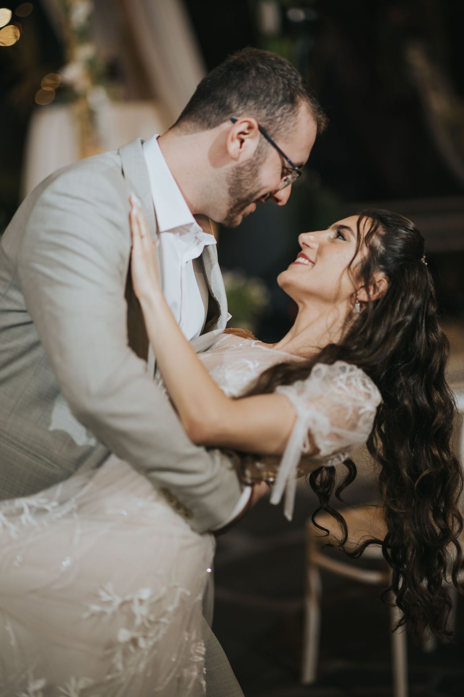 Romantic wedding dance pose in elegant vintage setting.