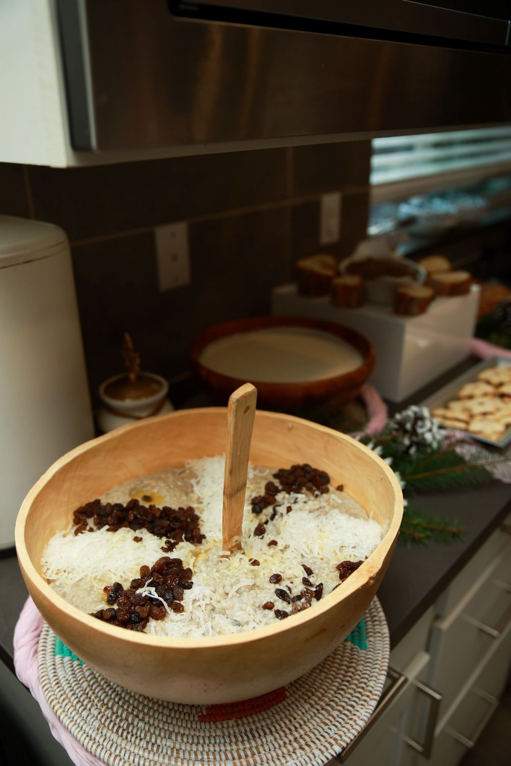 Brown ceramic bowl filled with coconut and chocolate garnish on display.
