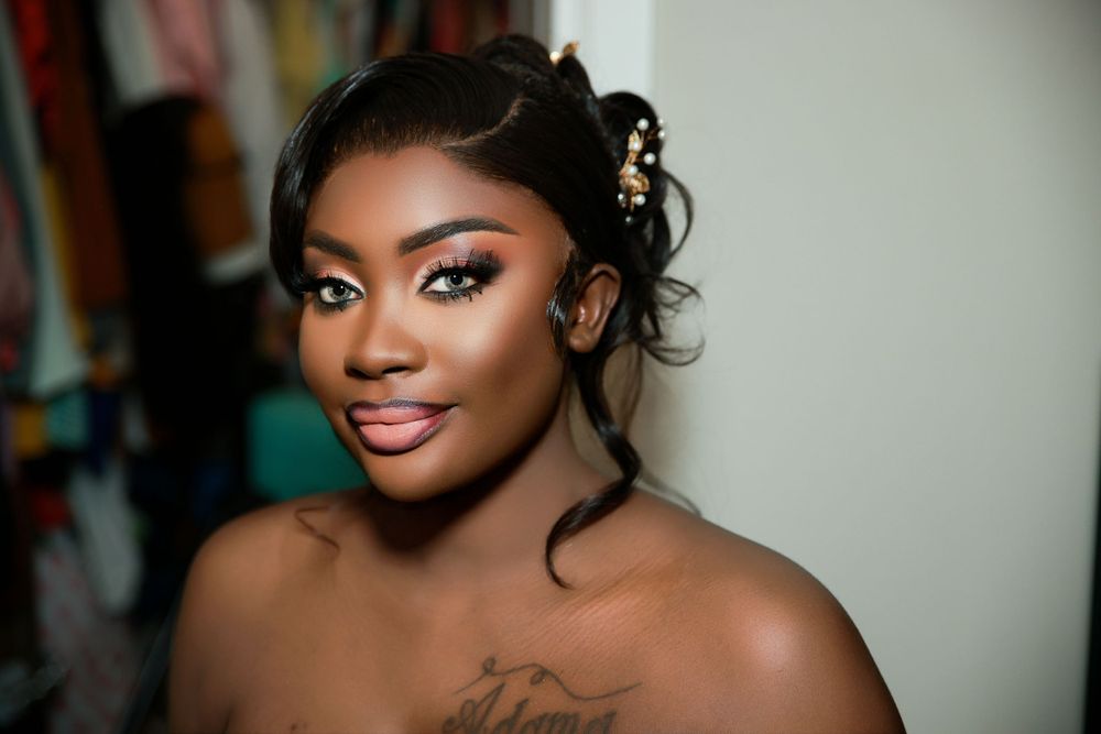Close-up beauty portrait showing dramatic evening makeup and elegant hairstyle.