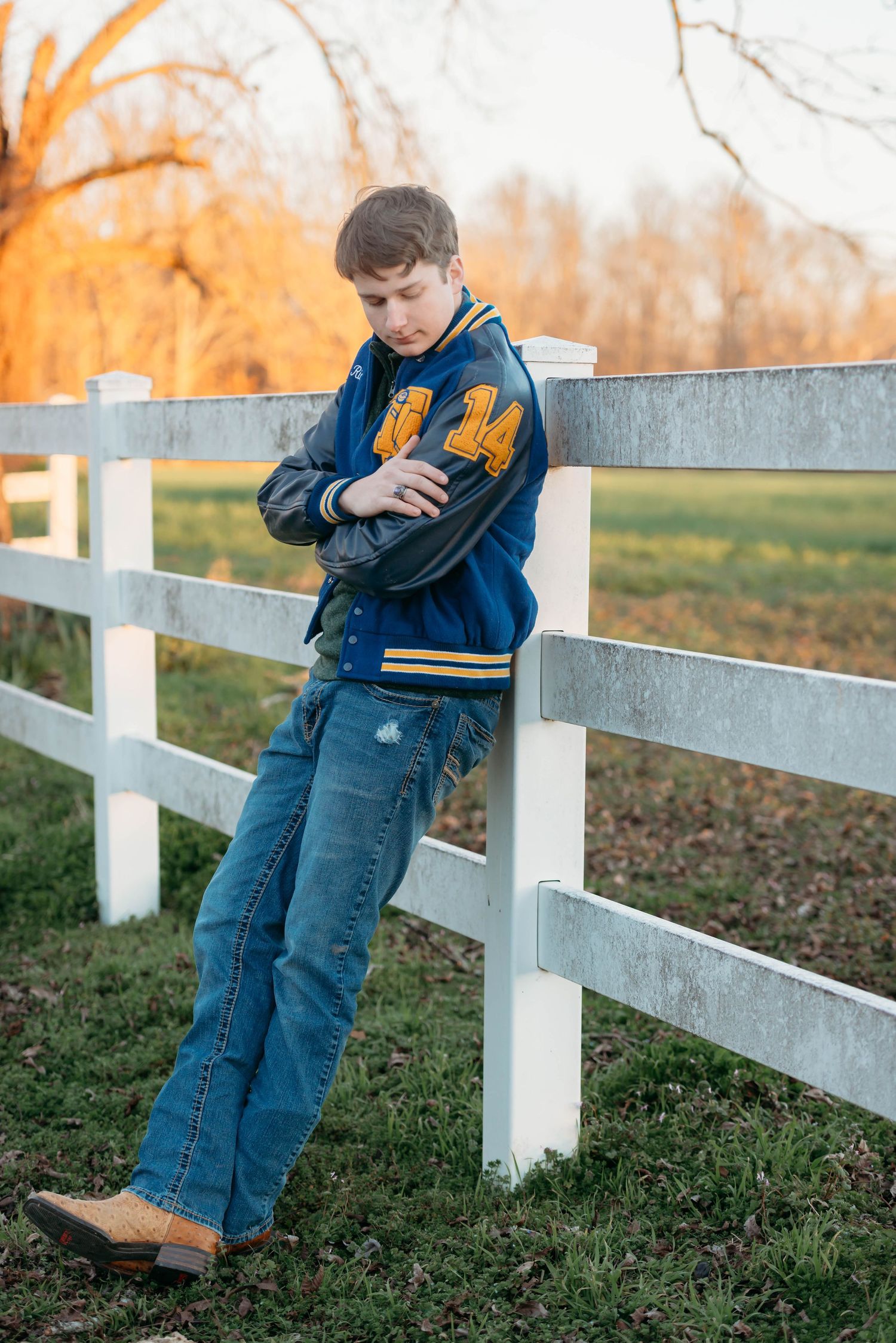 Tallulah la senior portrait session. Football, letterman, outdoor.