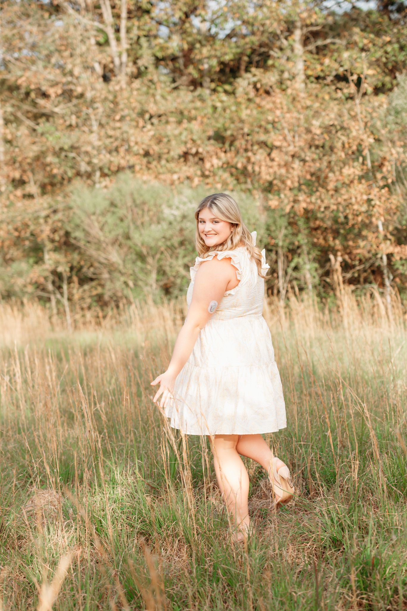 Monroe Lousiana. Female senior portrait session outdoors in a field