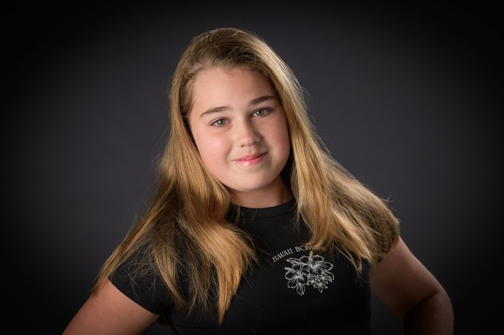 Series of portraits showing a young person with blonde hair against a dark backdrop.