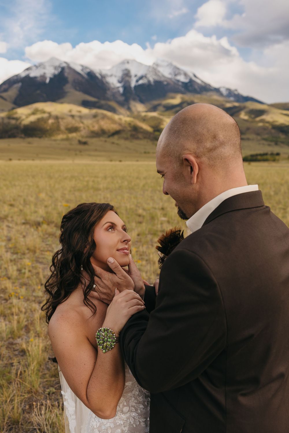 Paradise Valley Groom holds bride under the Mountains in Emigrant, Montana captured by Pray Montana Elopement Photographer Sabrina Marie