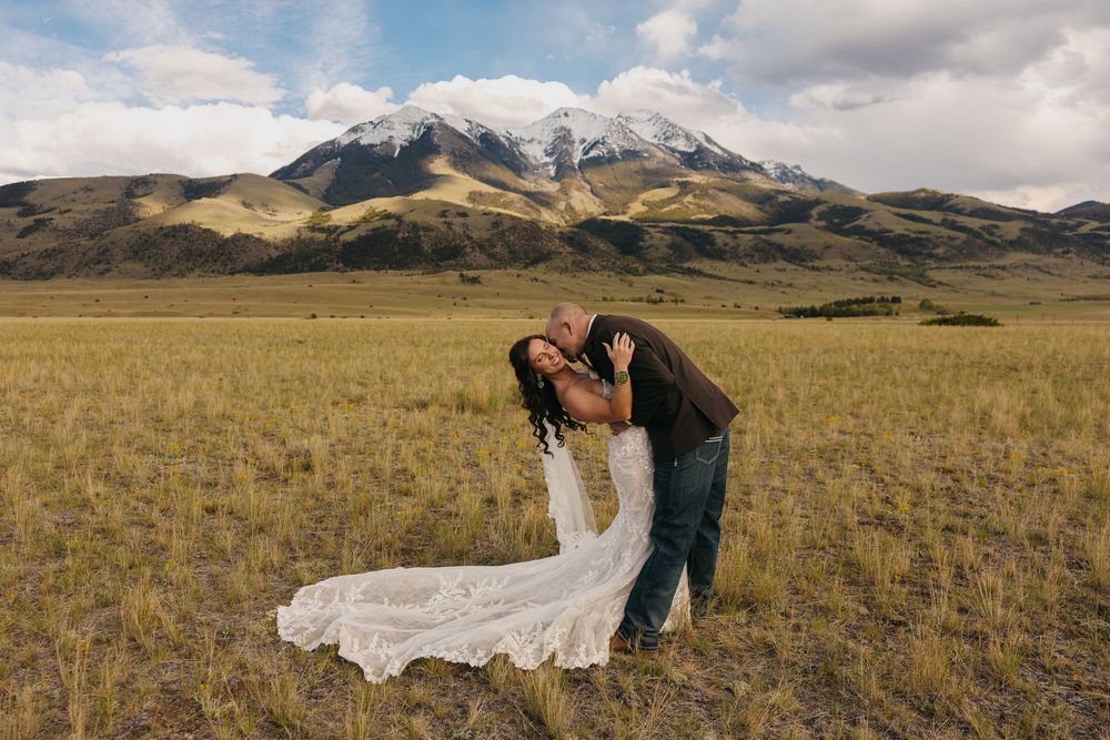 Pray, Montana bride & groom kiss under the Mountains in Emigrant, Montana captured by Pray Montana Elopement Photographer Sabrina Marie