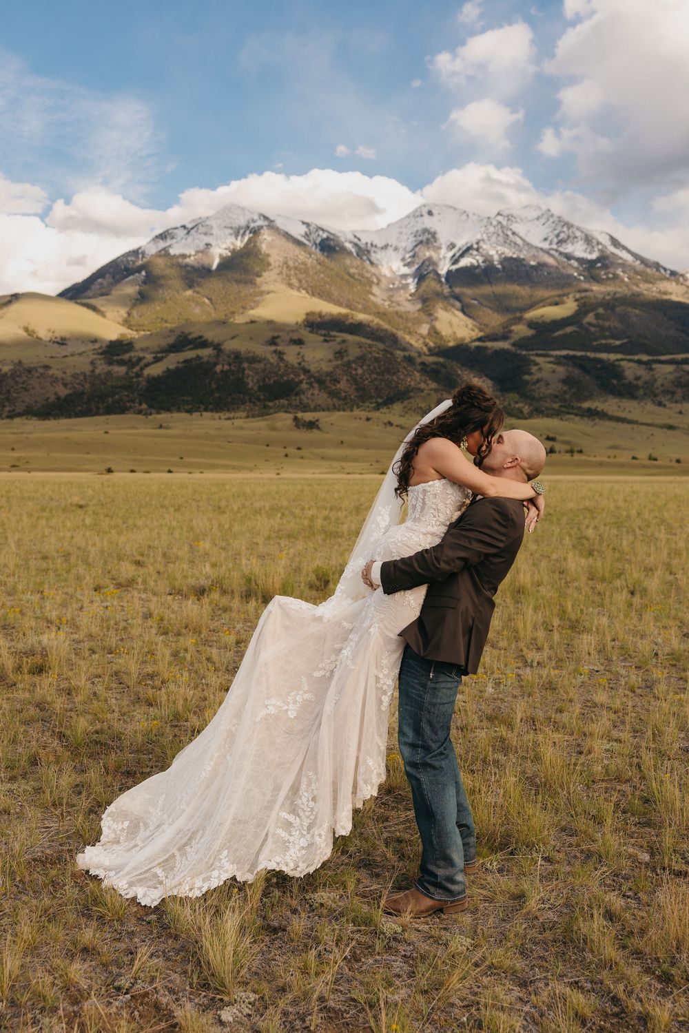 Paradise Valley bride & groom kiss under the Mountains in Chico, Montana captured by Pray Montana Elopement Photographer Sabrina Marie