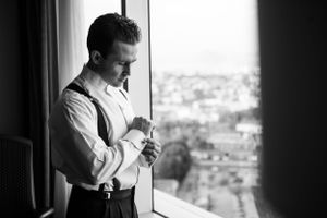 Black and white portrait series showing intimate moments by a window.