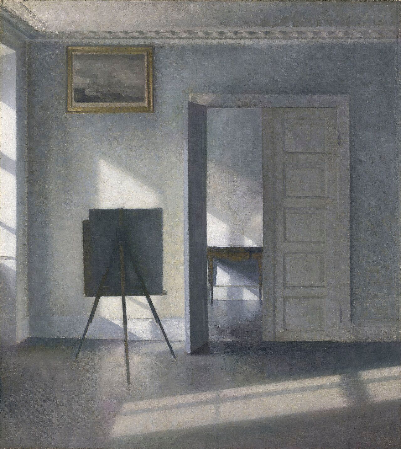 Quiet interior painting with an easel, open door, and sunlight casting shadows on pale blue-gray walls.