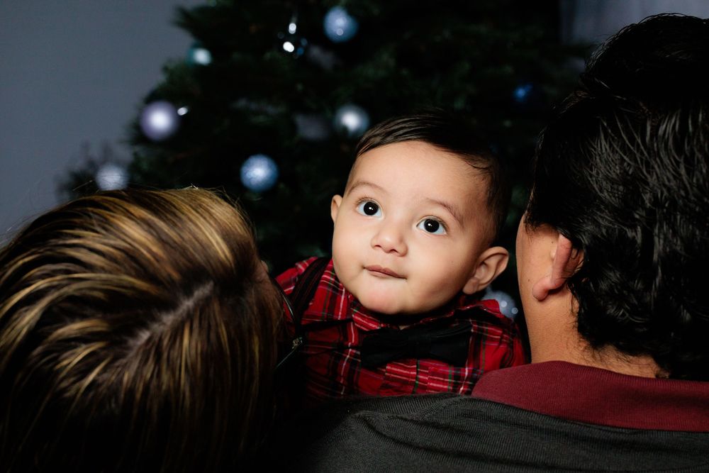 Family photoshoot with a loving mother and father to their newborn.