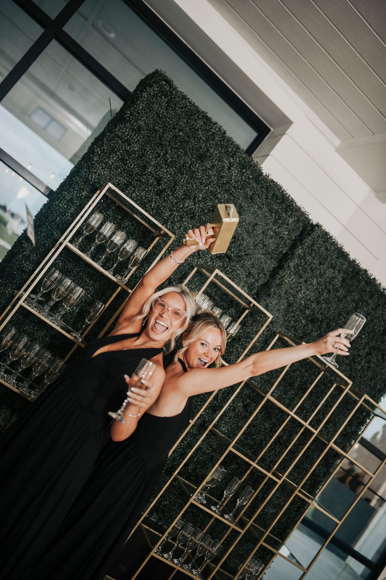 Friends and family dancing the night away beneath candlelight reception decor