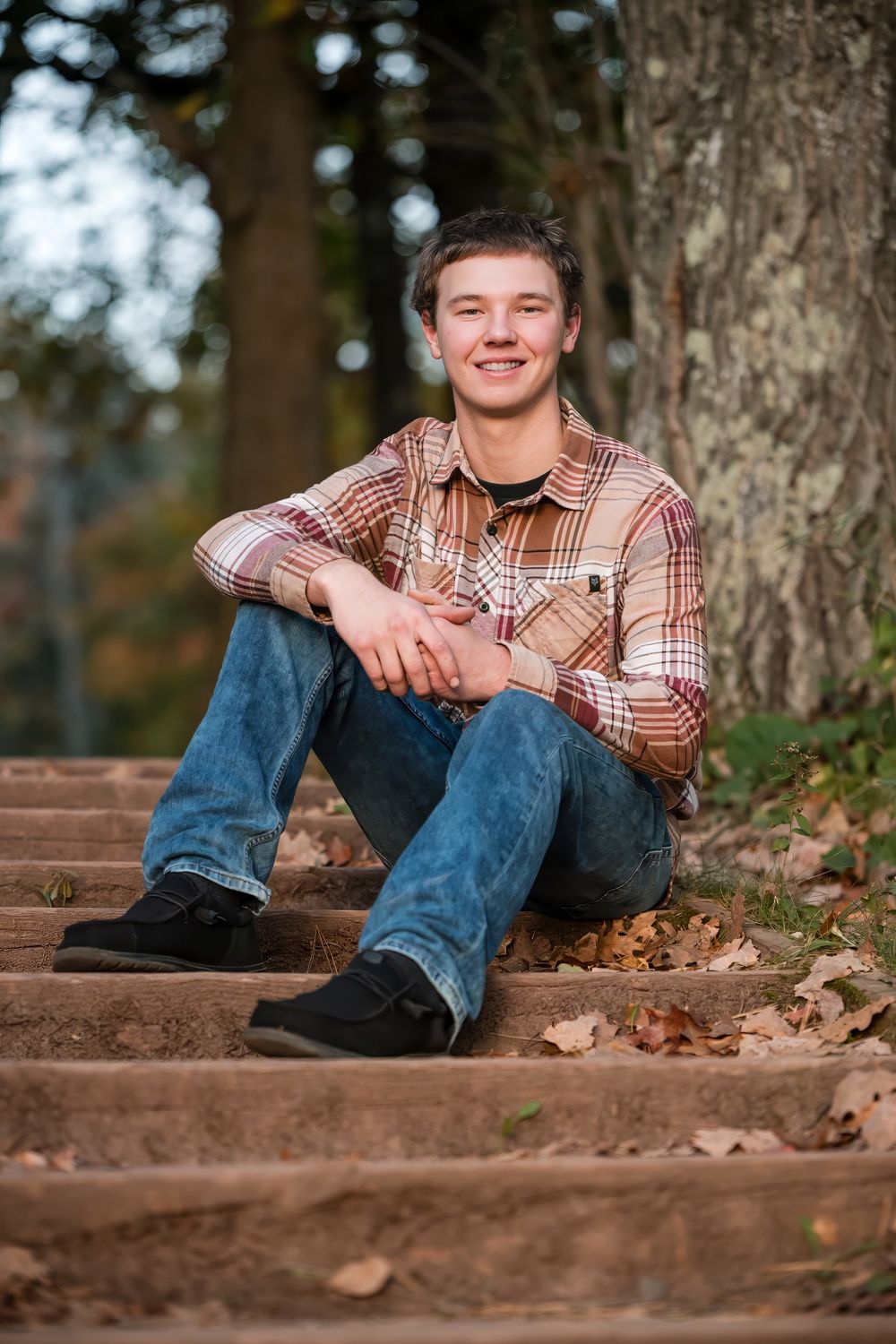 Senior pictures on staircae in Jay Cooke State Park