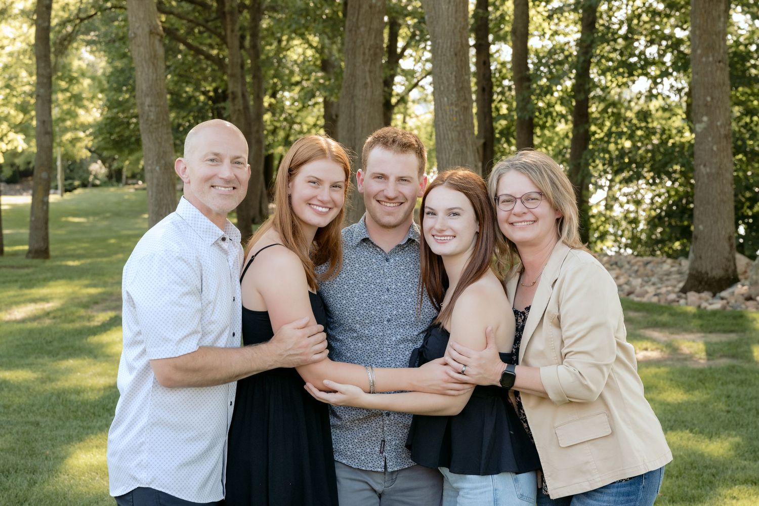 family closeup during outdoor family session at family cabin in chippewa falls, wisconsin
