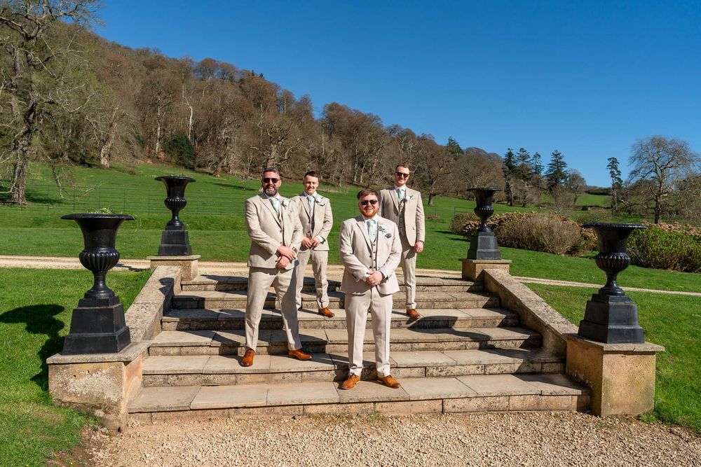 Groom and groomsmen on steps outside Crowcombe Court Somerset Wedding venue