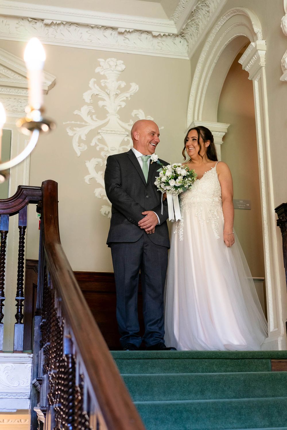 Bride and father at top of staircase pre ceremony at Crowcombe Court