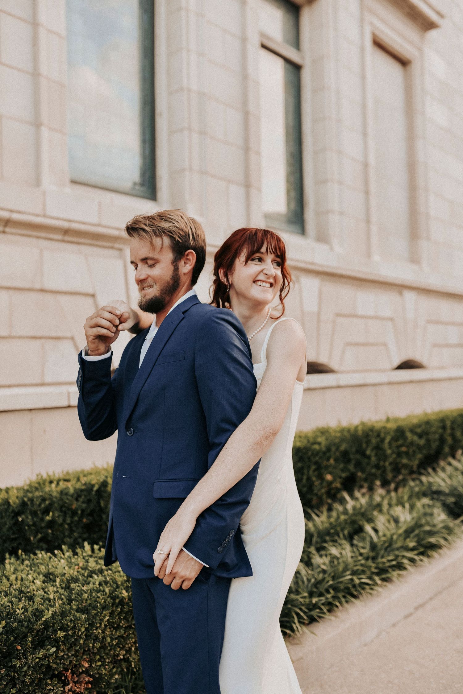 Downtown Dallas engagement photos featuring historic arches