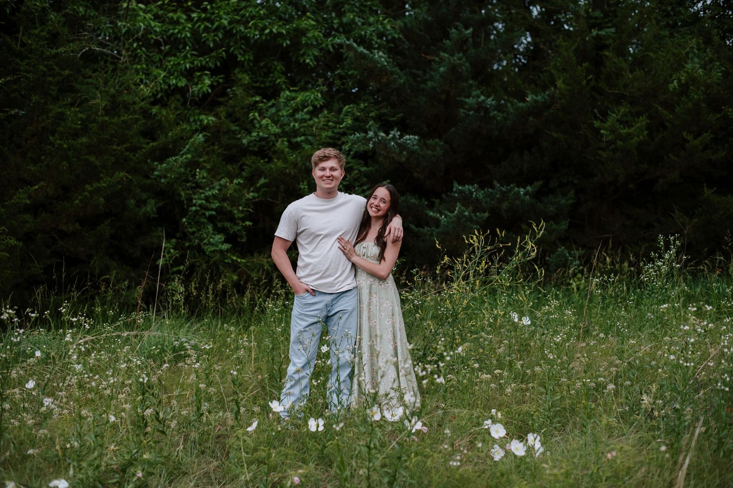 Wichita KS outdoor engagement photos in nature location Andover, couple photos in field with flowers, small elopement wedding photographer