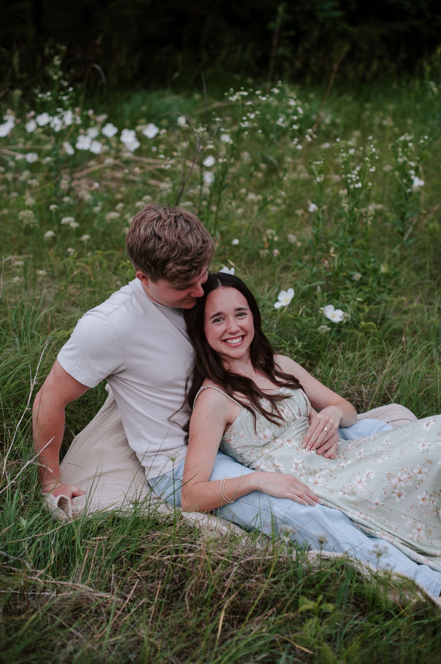 Wichita KS outdoor engagement photos in nature location Andover, couple photos in field with flowers, small elopement wedding photographer