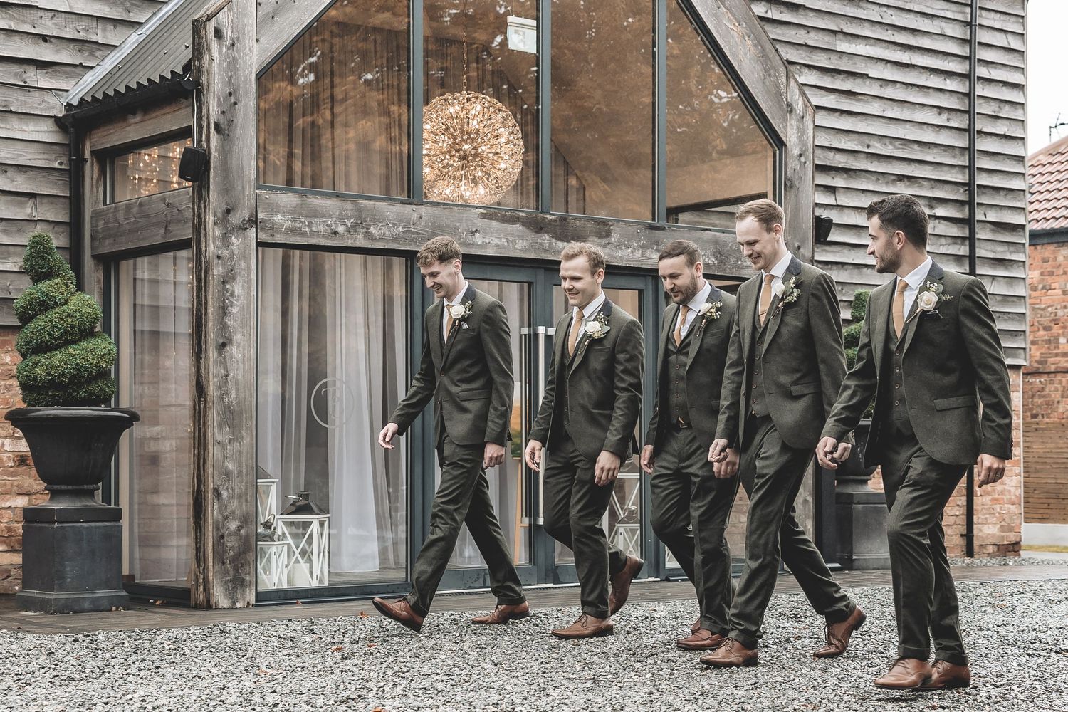 A guided groomsmen photo in front of the Barn At Willerby Hill wedding venue.