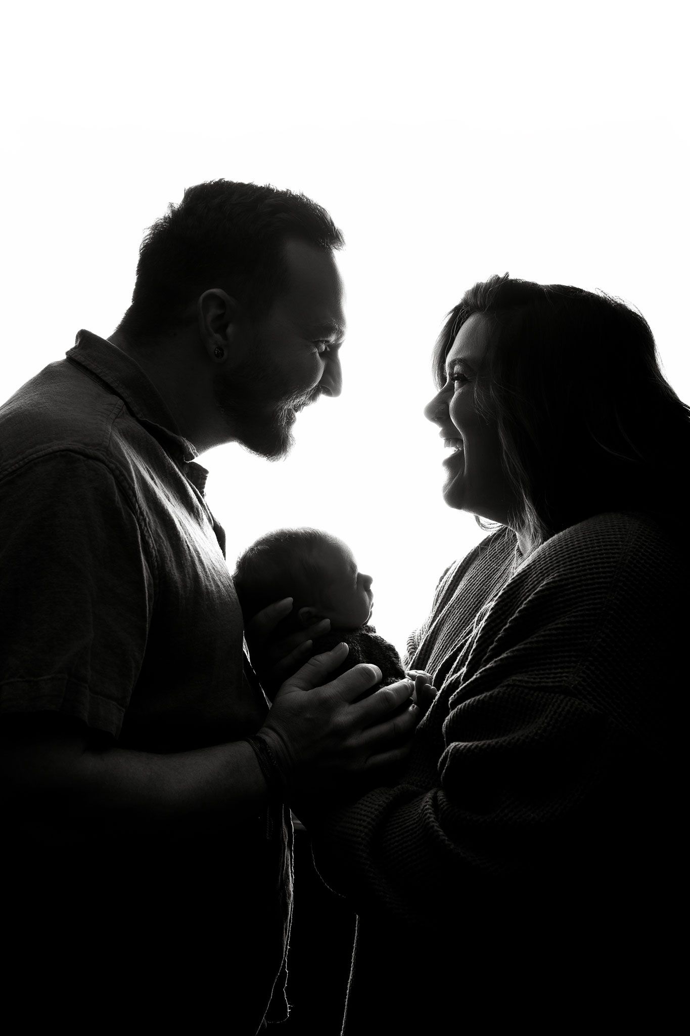 Silhouetted couple in romantic embrace shown in four progressive frames against white background.