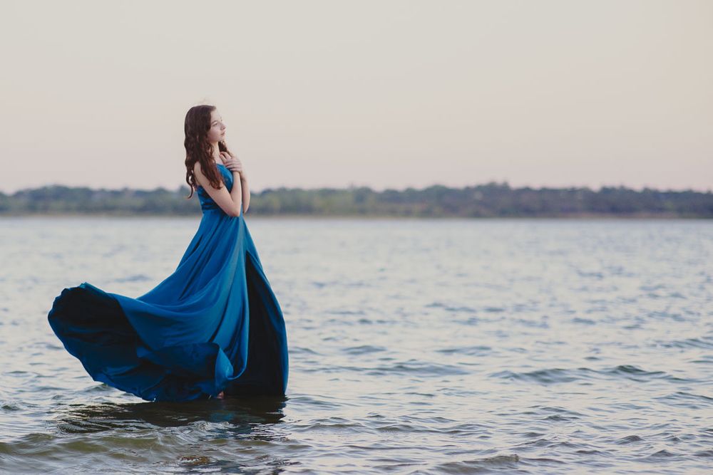 Individual creative photoshoot of female in blue dress on a lake, by Brian Balloon Media