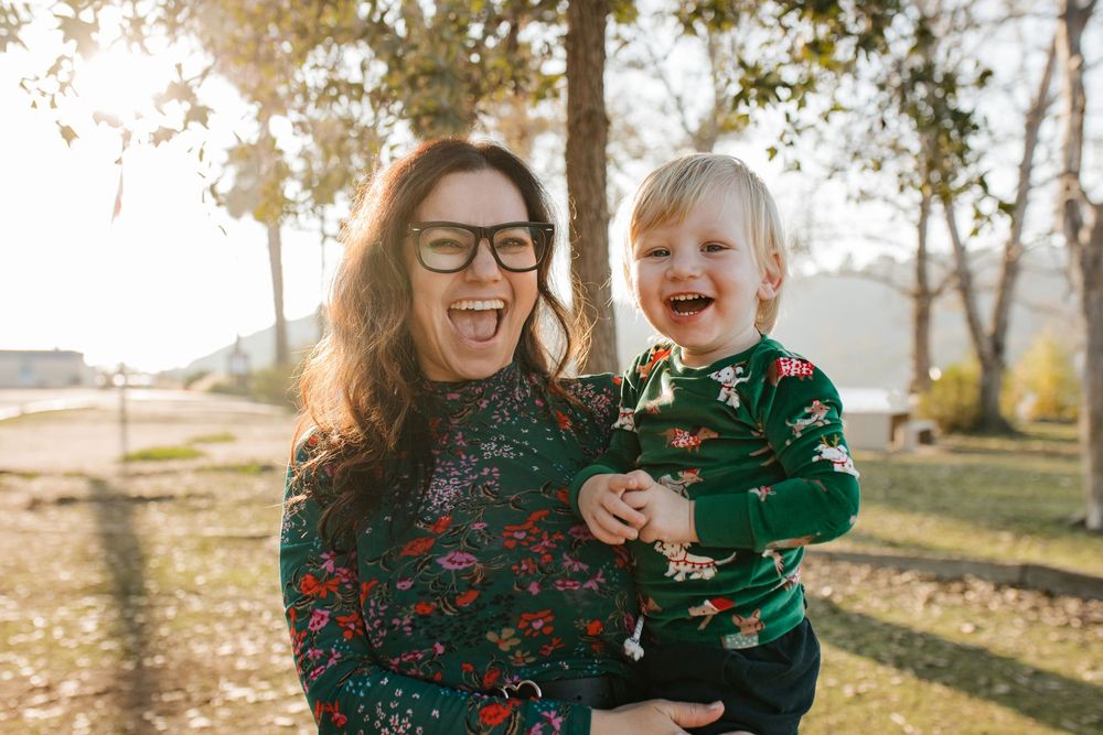 Mother and son pose in matching Christmas outfits in Los Angeles.