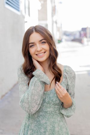 Senior session with girl standing in an urban street scene with soft natural lighting in Springfield, Missouri.