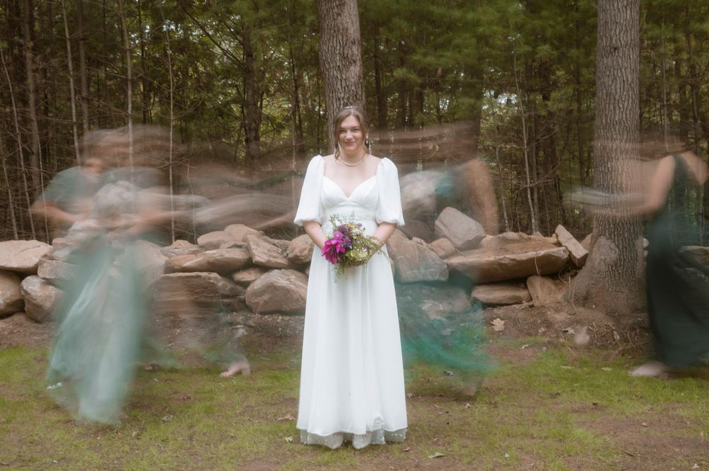 A sequence of outdoor photos shows people in blue and white dresses standing near trees and stone walls.