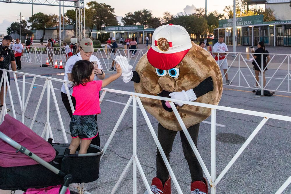 Community 5K run photography in Houston capturing running moments